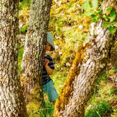 Child playing on the causse of Villeneuve d'Aveyron